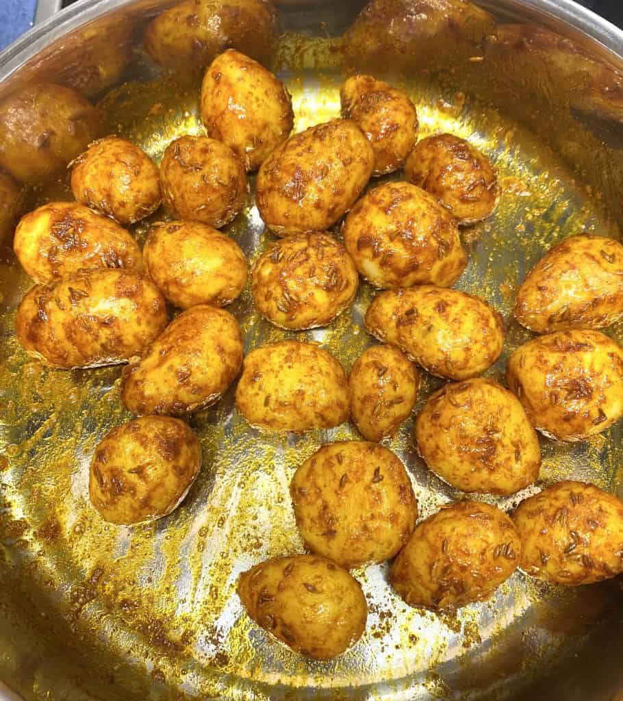 Dum Aloo is a spicy, creamy Indian curry made with baby potatoes