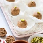 Fasting ladoo for navaratri or mahashivaratri made from sabudana, peanuts and jaggery served in cupcake liners on a white background